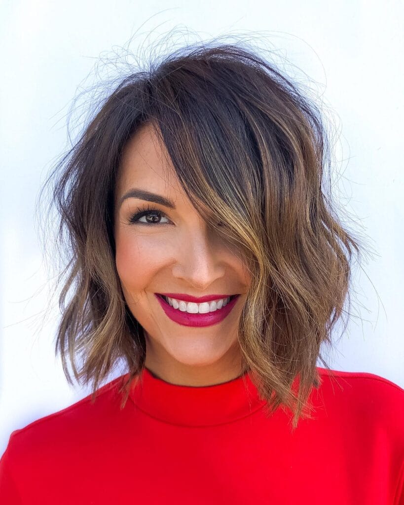 Short wavy bob with soft highlights and light textured layers.