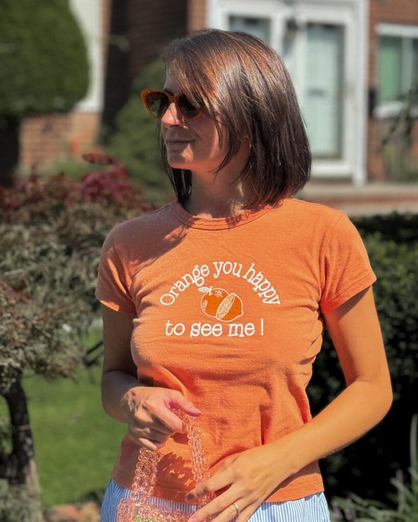 Shoulder length straight brunette bob with a sleek and glossy finish.