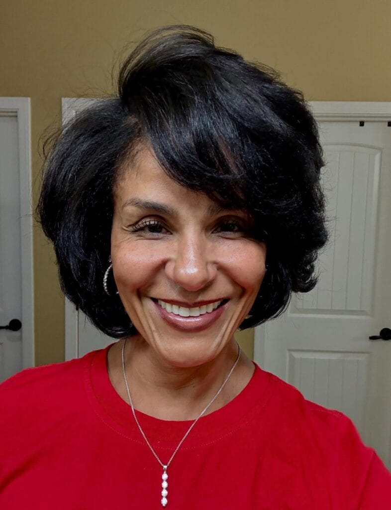Short voluminous bob with soft layers and side swept fringe.