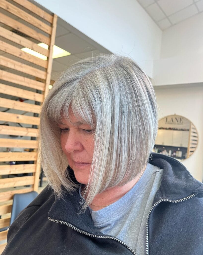 Angled gray bob with a full fringe and longer front sections.
