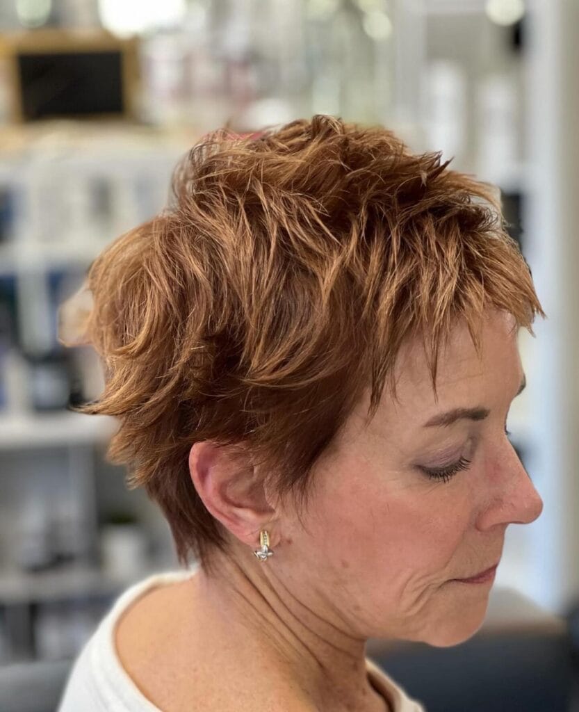 Short pixie bob with choppy layers and textured finish.