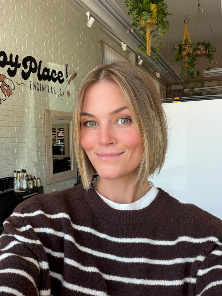 Short blonde layered bob with a soft rounded shape.