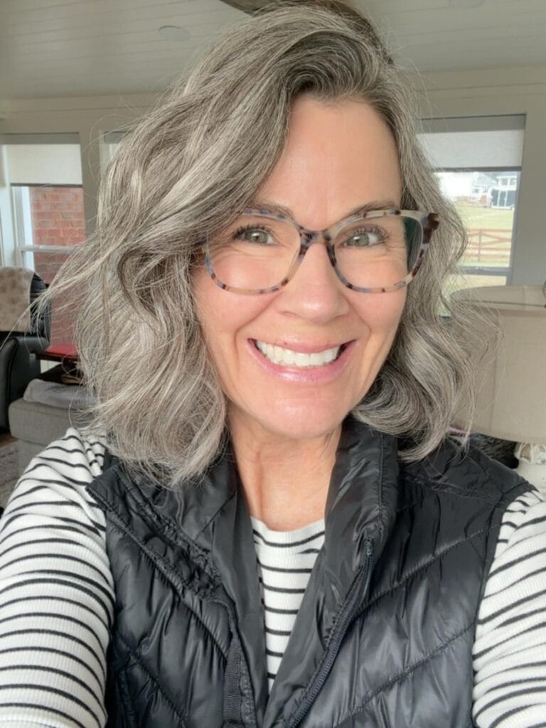 Silver layered bob with soft waves and natural volume.