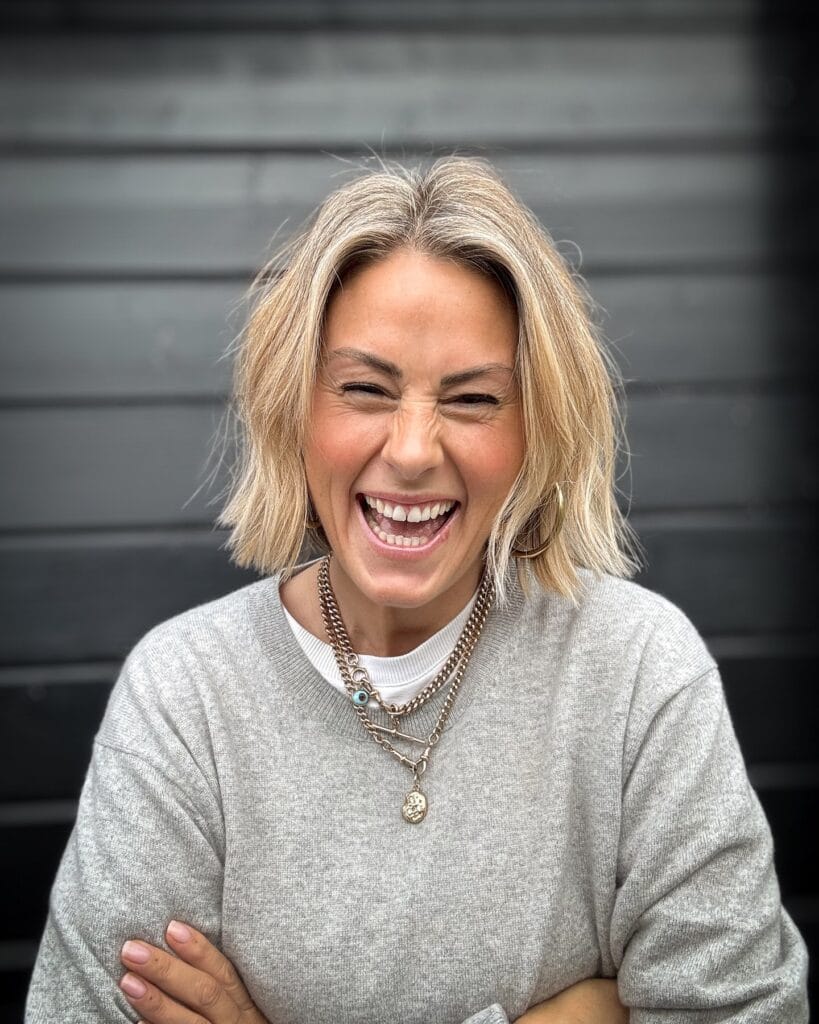 A layered messy bob with face framing pieces and soft blonde texture.