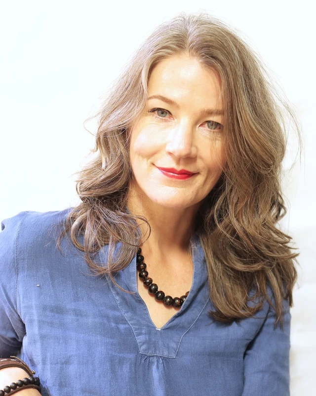 Long brown hair with soft loose waves and layers.