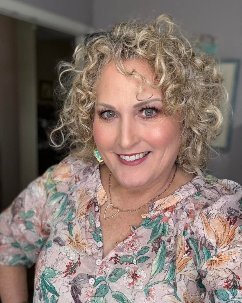 Short curly bob with defined curls and layered shape.