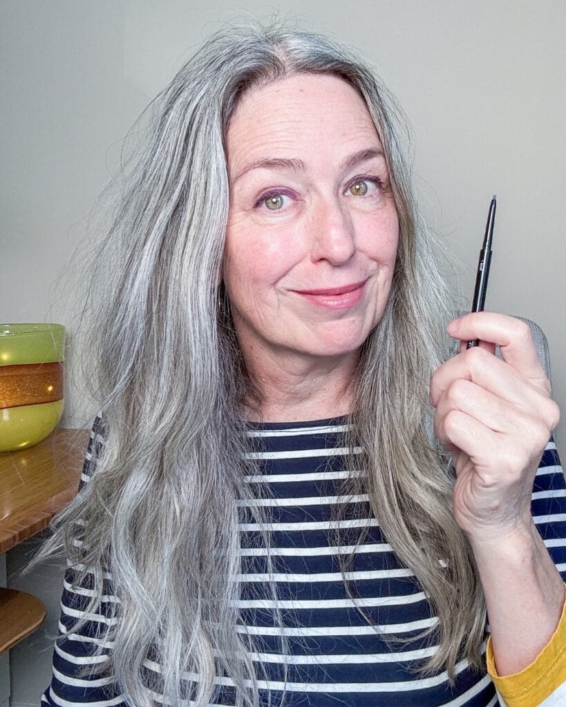 Long straight silver layered hairstyle with smooth texture and soft ends.