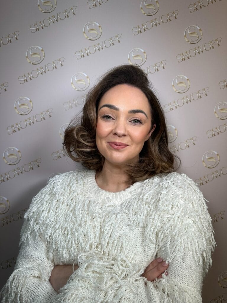 Short brunette wavy bob with soft rounded waves and volume.