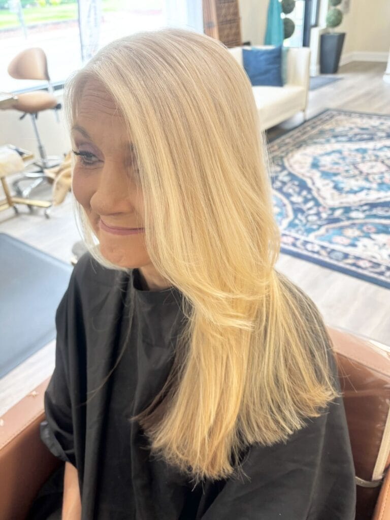 Long straight blonde hair with subtle layers at the ends and a smooth finish.