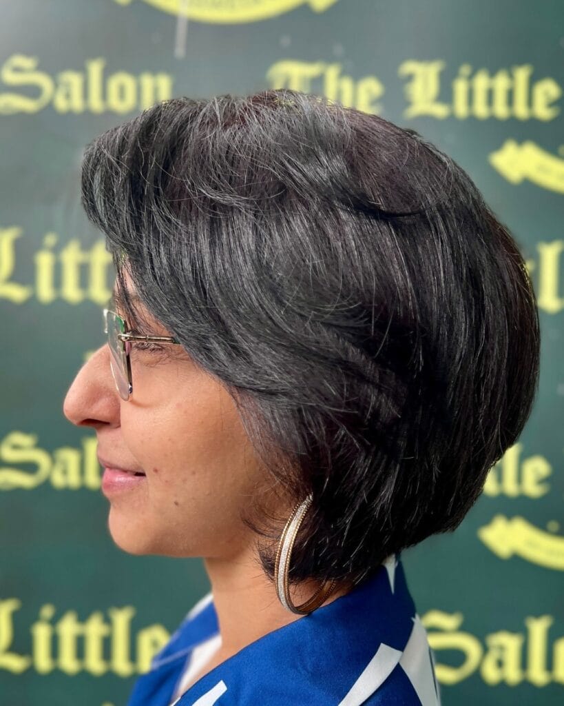 Short layered bob with side volume and a soft, rounded shape.
