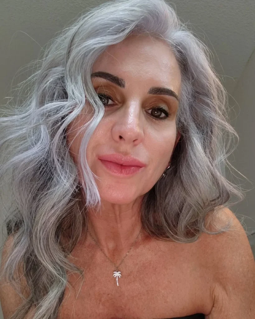 Ultra long straight silver gray hair flowing past the chest.