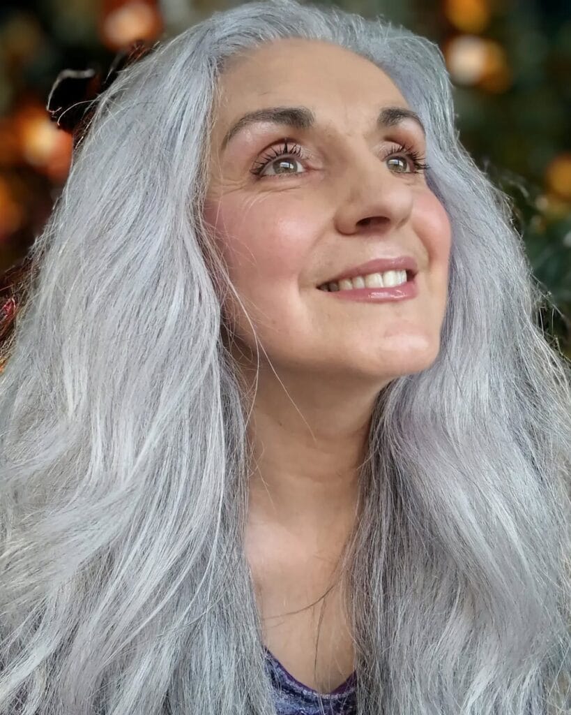 Long gray hair with a clean center part and smooth texture.