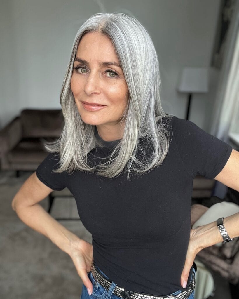 Straight shoulder length silver lob with a center part and smooth finish.