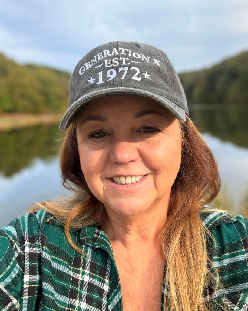 Long brunette hairstyle with soft layers and a natural side part.