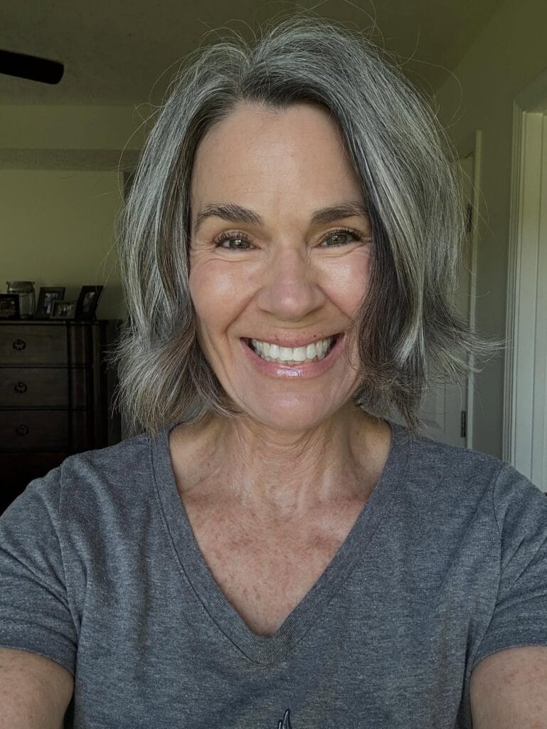 Shoulder length gray bob with soft layers and natural movement.