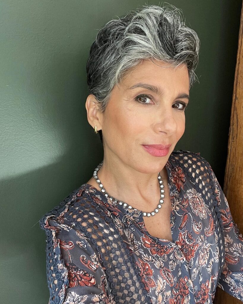 Short gray wavy crop with soft side volume and layered texture.