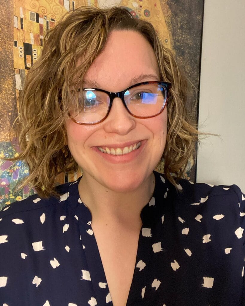 Chin length light brown wavy bob with loose waves and soft shape.