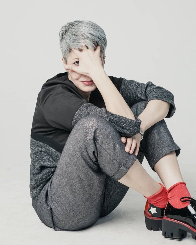 Silver textured crop haircut with short sides and choppy layered top.