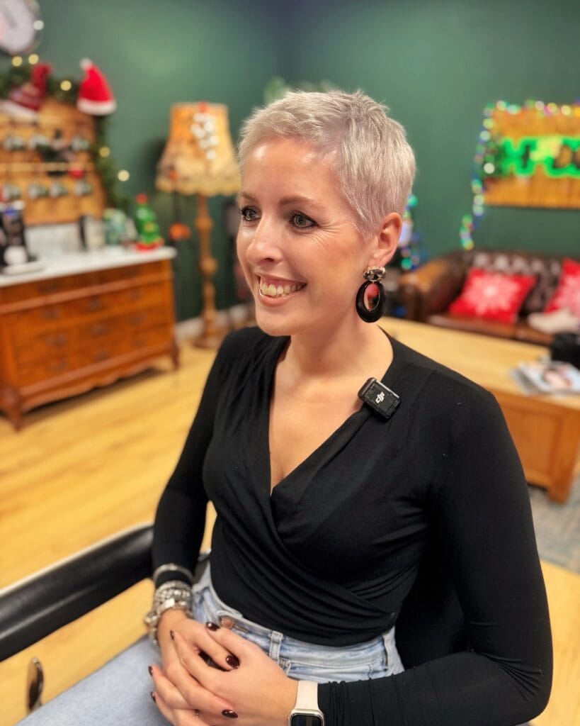 Very short silver pixie crop with soft textured top and closely trimmed sides.