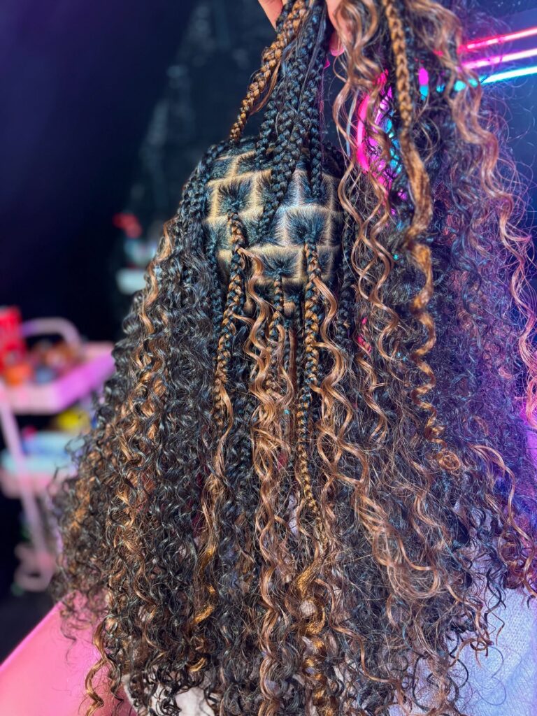 Half up goddess braids with curly highlighted ends and detailed square braid sections.