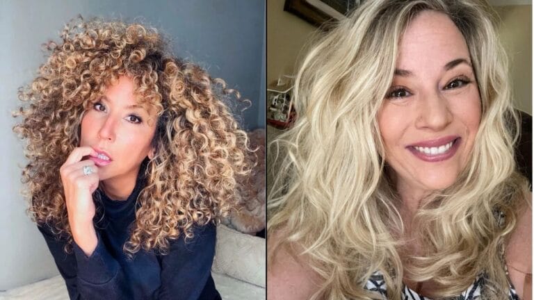 Voluminous curly hairstyle with tight defined curls on one side and long loose blonde waves on the other.