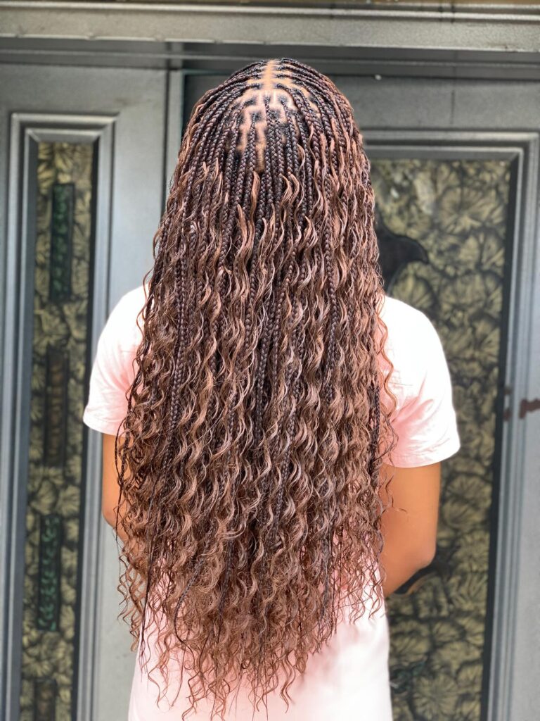 Chocolate brown goddess braids with long wavy strands and micro braided sections.