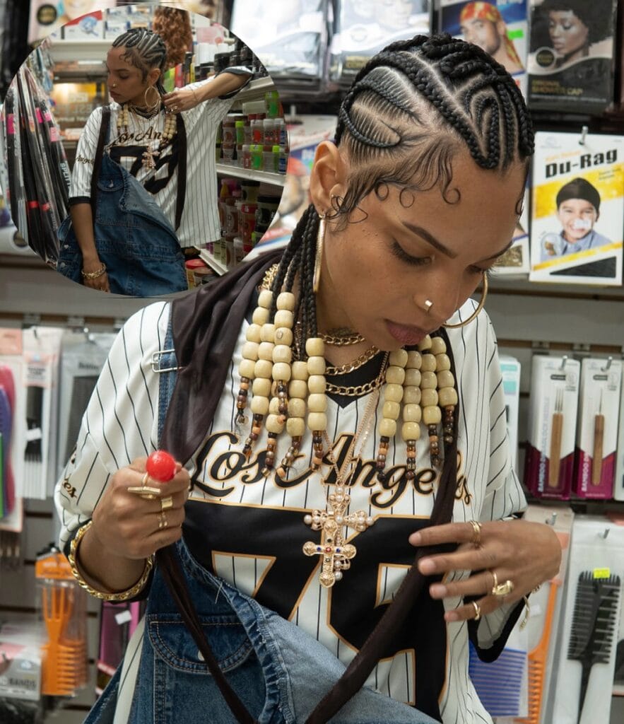 Cornrow braids styled into long loose braids with chunky wooden beads at the ends.