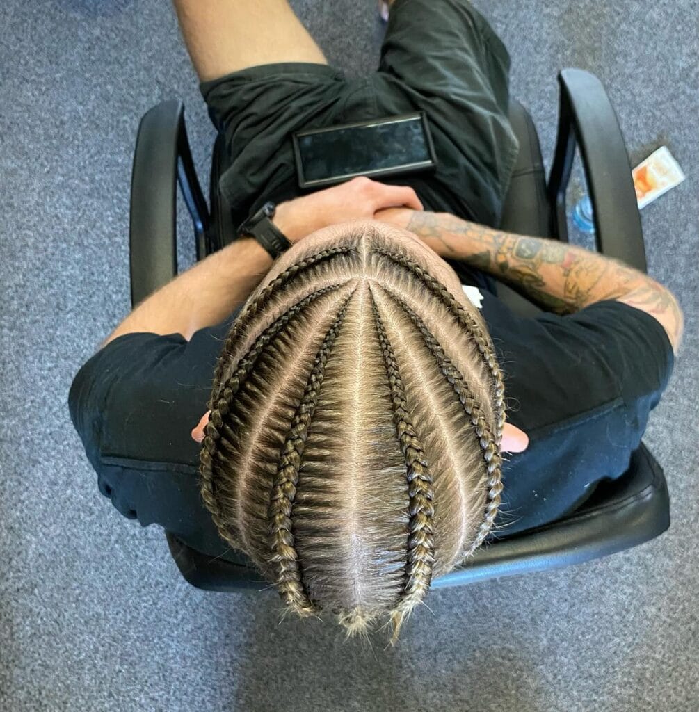 Neat straight back cornrows braided evenly across the scalp.