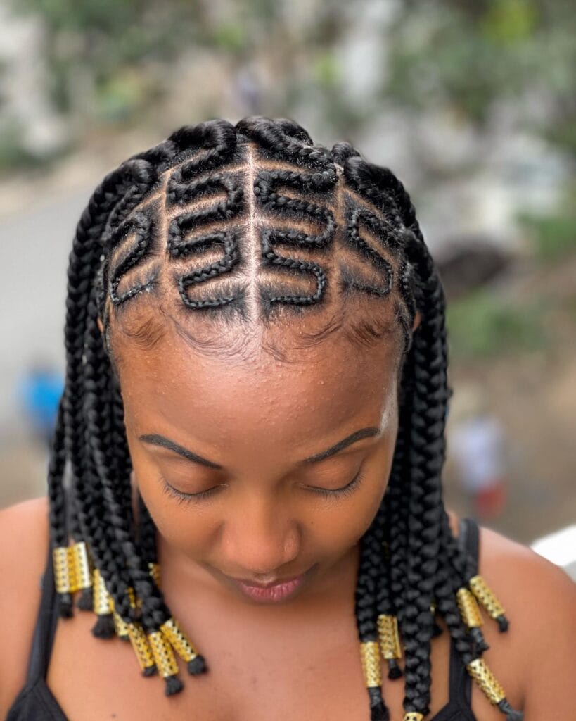Medium cornrow braids with small beads decorating the ends.