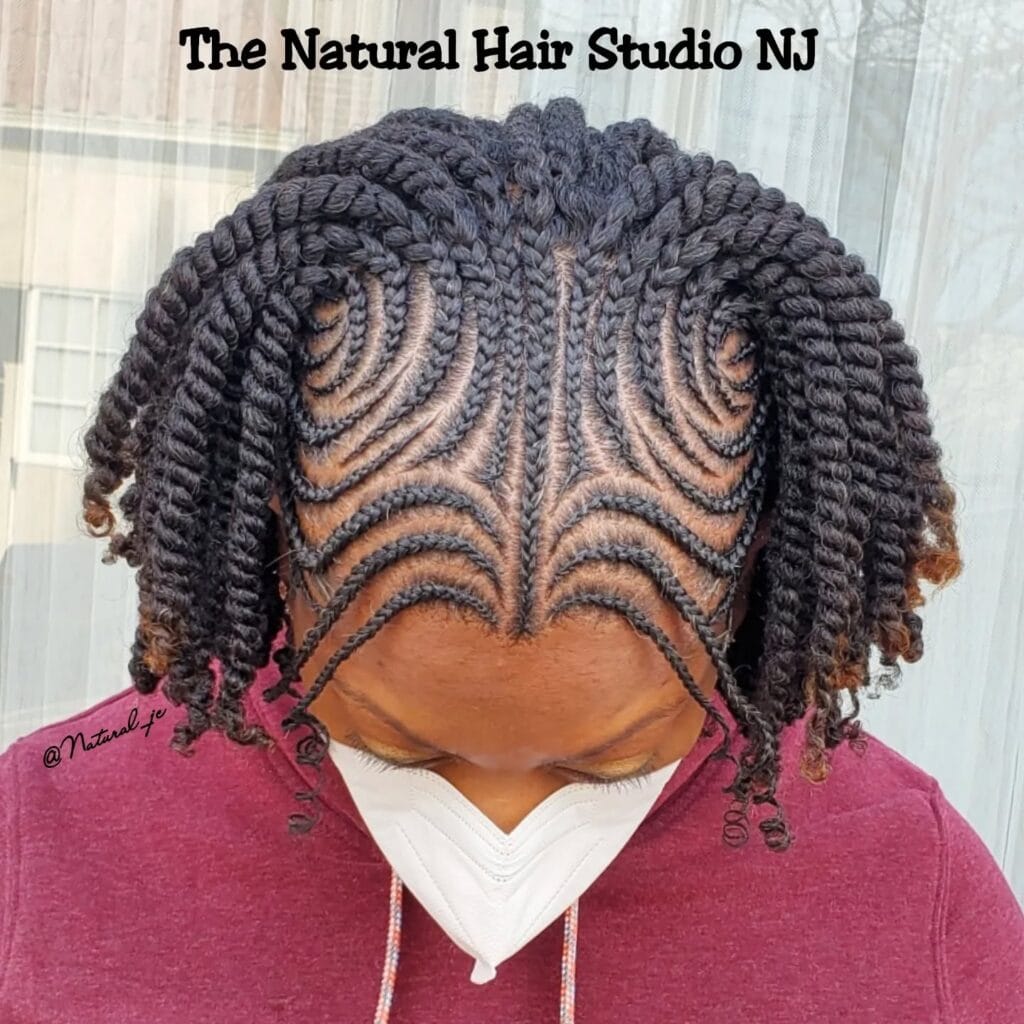 Curved cornrow pattern ending in short textured twists.