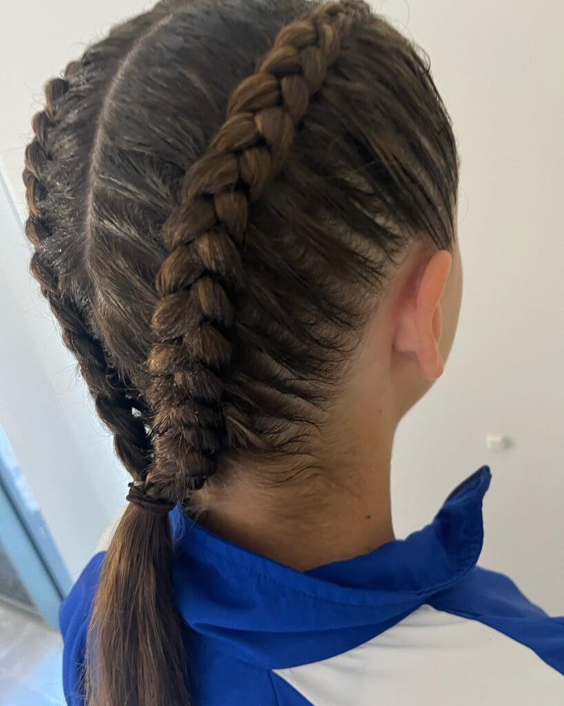 Two Dutch braids running from the hairline to the back of the head.