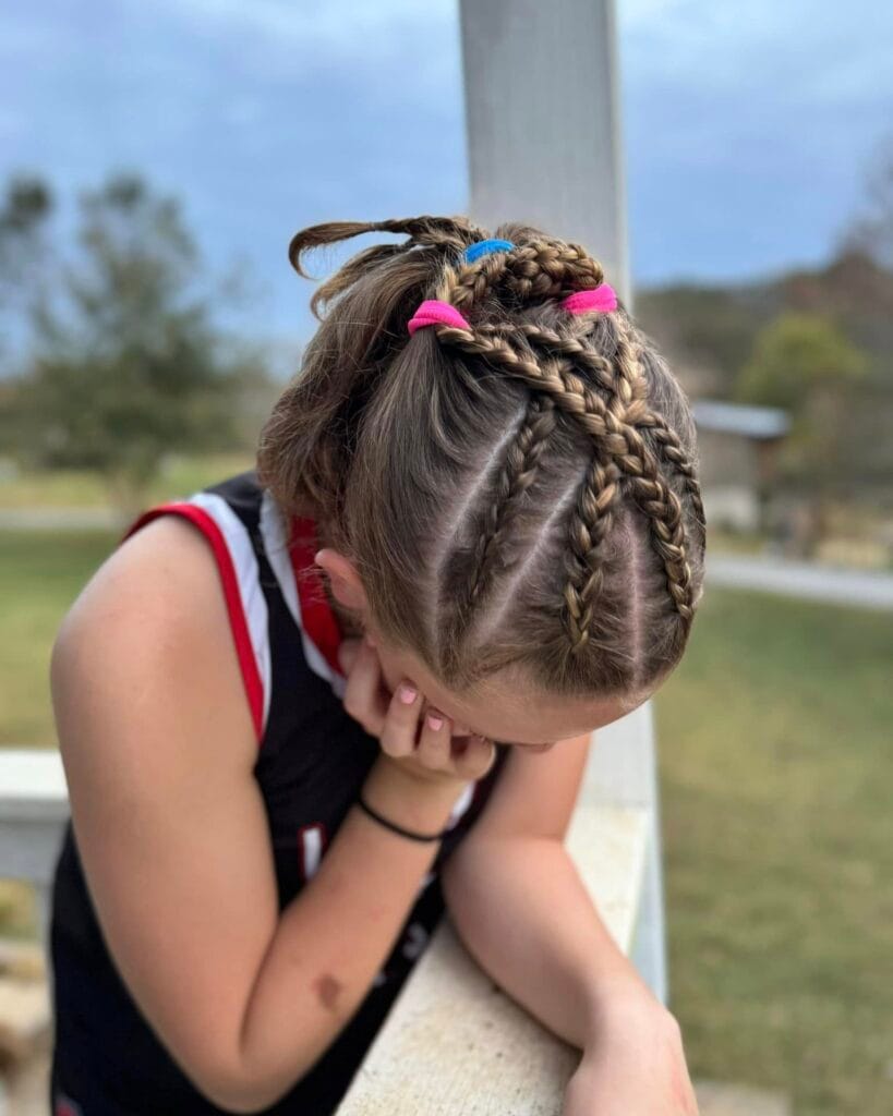 Front cornrows leading into a braided ponytail for a sporty hairstyle.