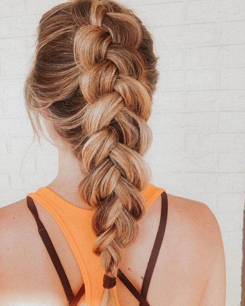 Classic French braid starting at the crown and braided down the back.