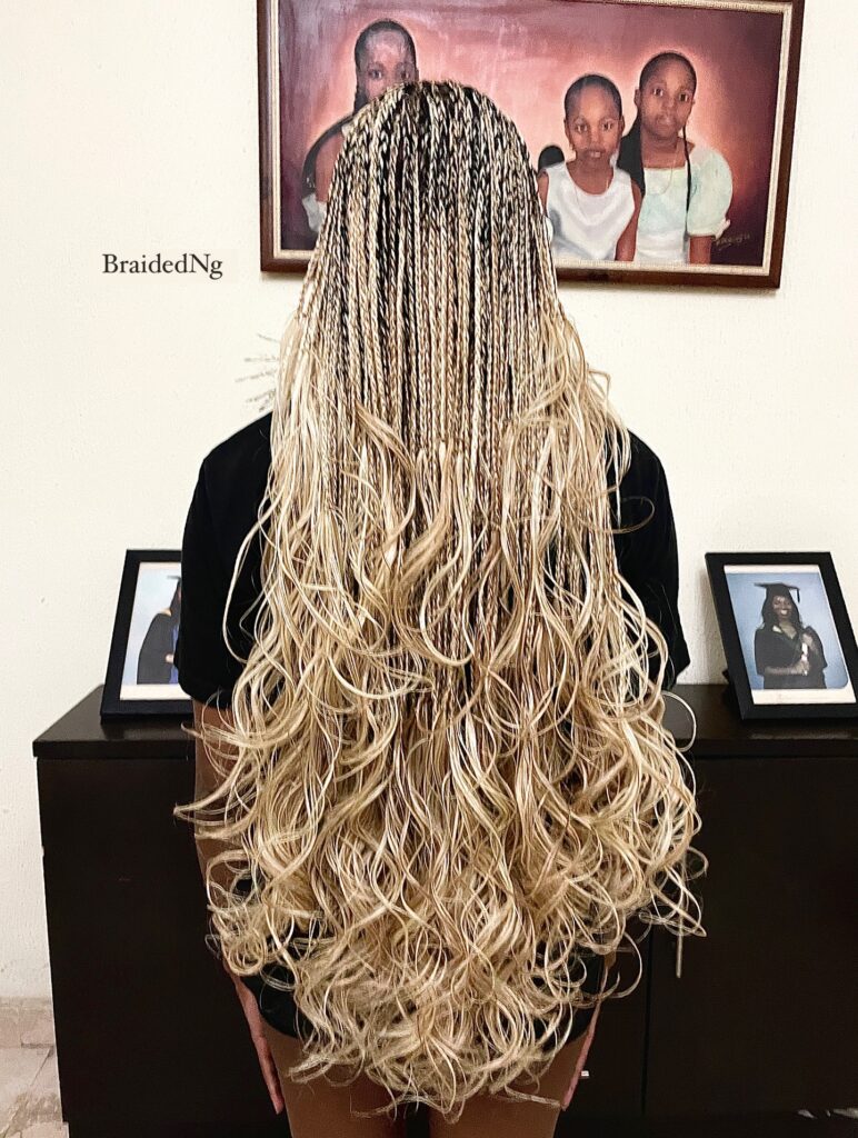 Long blonde micro braids with loose wavy ends.