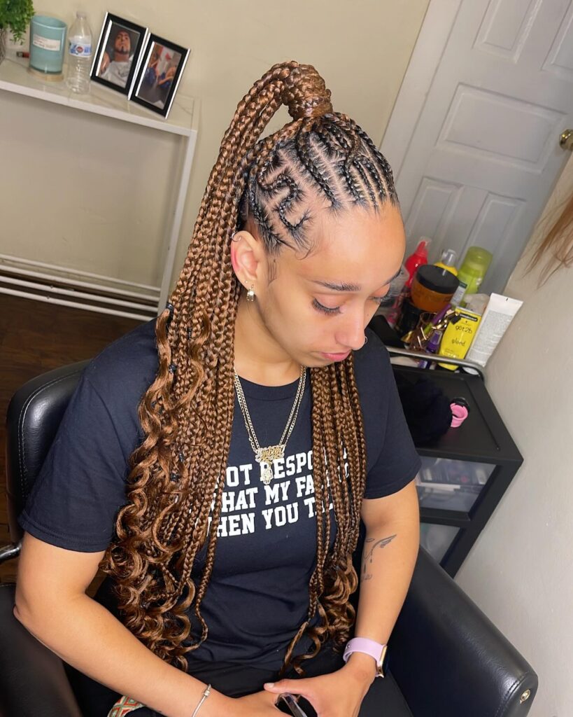 Brown braided ponytail with detailed scalp braids and curled ends.