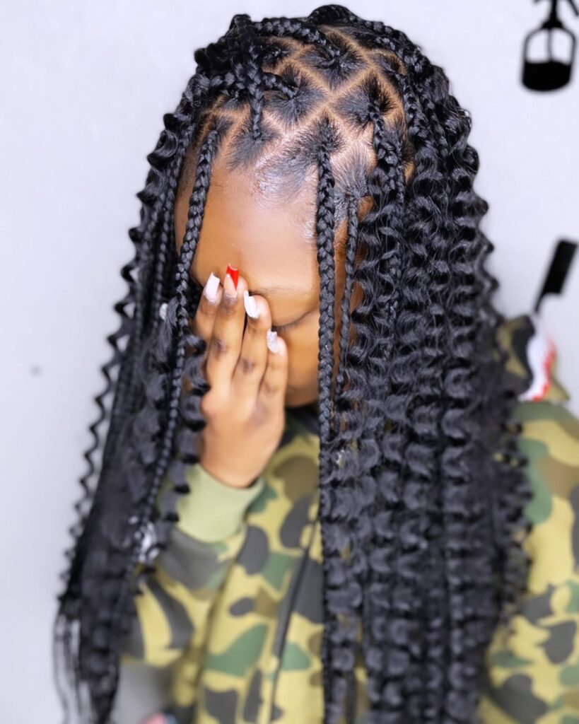 Island braids with neat patterned parts and curly ends.
