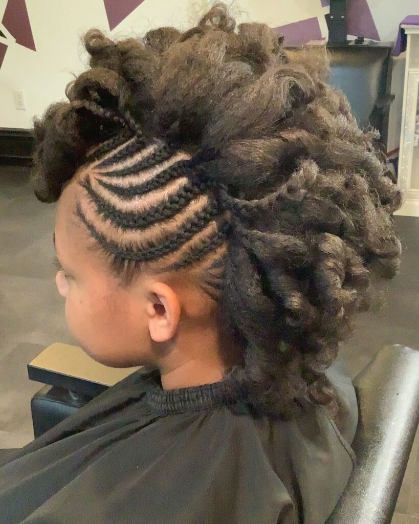 Chunky twisted mohawk hairstyle with side cornrows and voluminous textured twists.