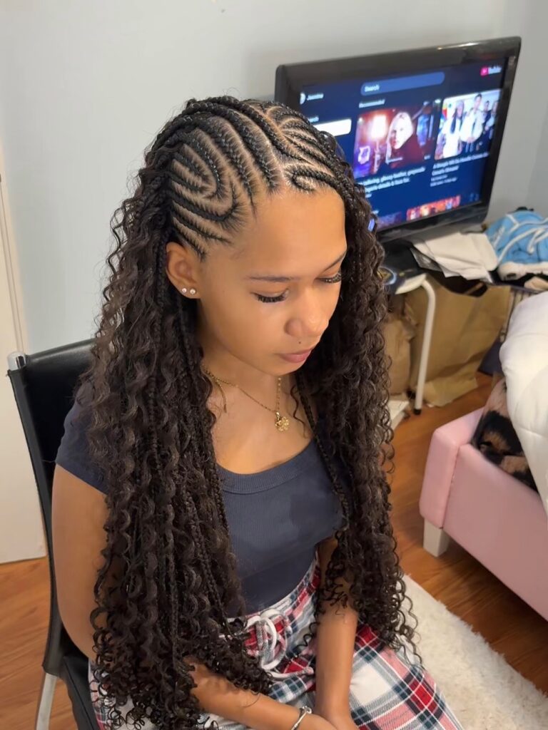 Swirled cornrow braids transitioning into long curly braids with volume.