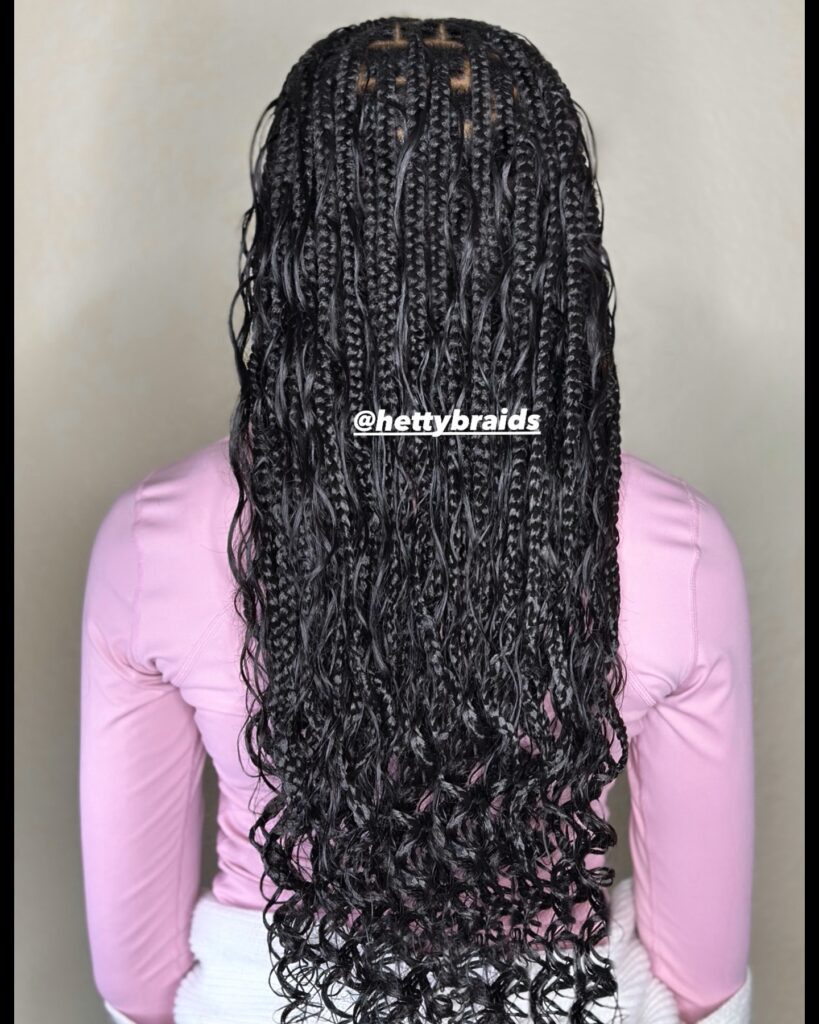 Medium length braids with loose curly ends and a soft bohemian textured finish.