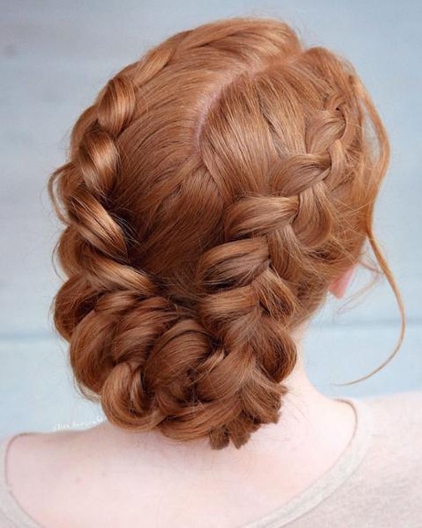 Ginger red double braided updo with two Dutch braids and a twisted low bun.