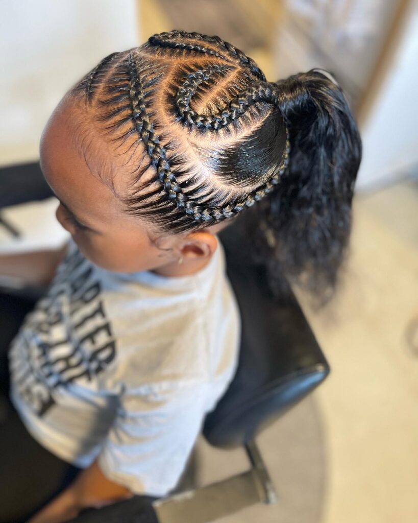 A sleek ponytail with swirl braid patterns and detailed braided sections on the scalp.
