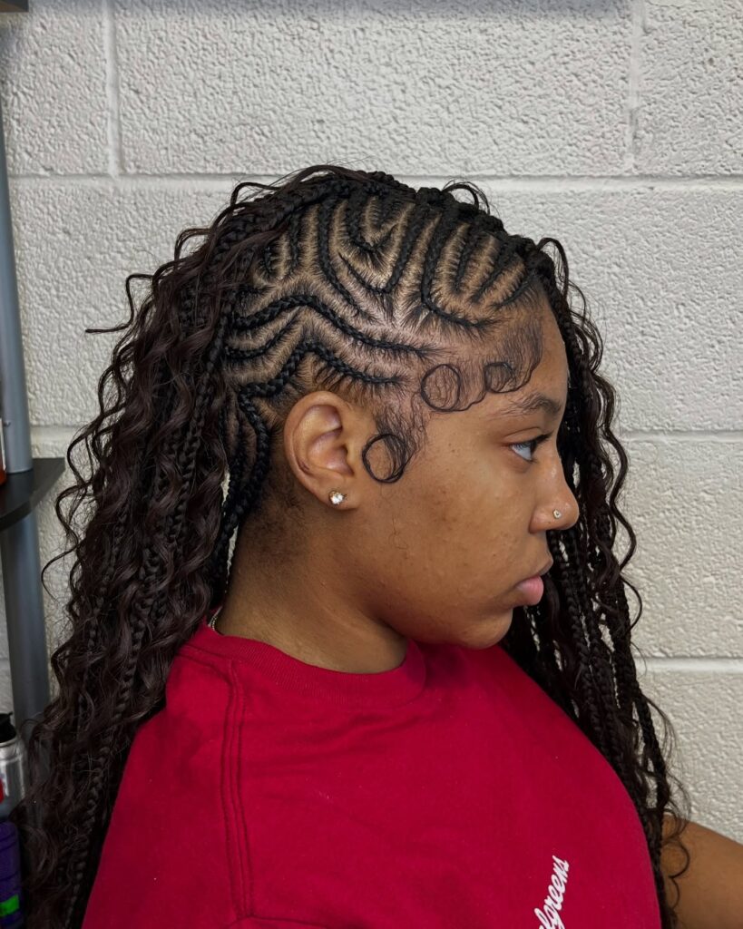 Side parted braided hairstyle with scalp braids, loose curls, and styled baby hairs.