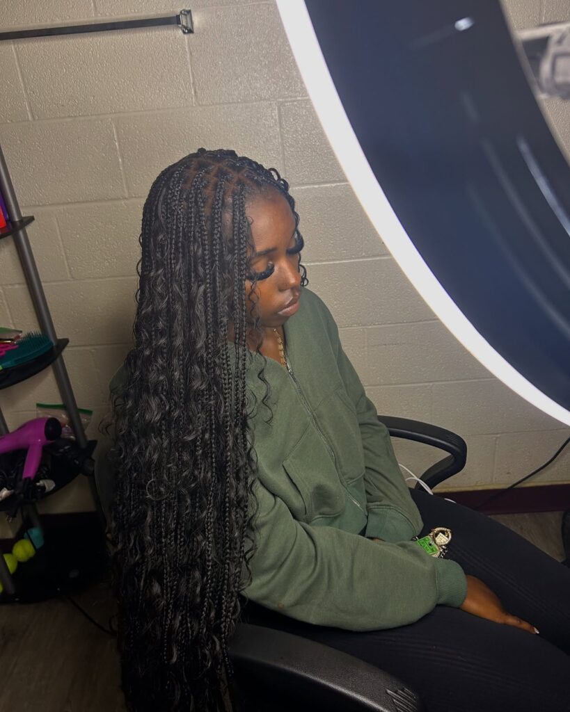 Extra long braids mixed with loose wavy pieces and a textured natural finish.