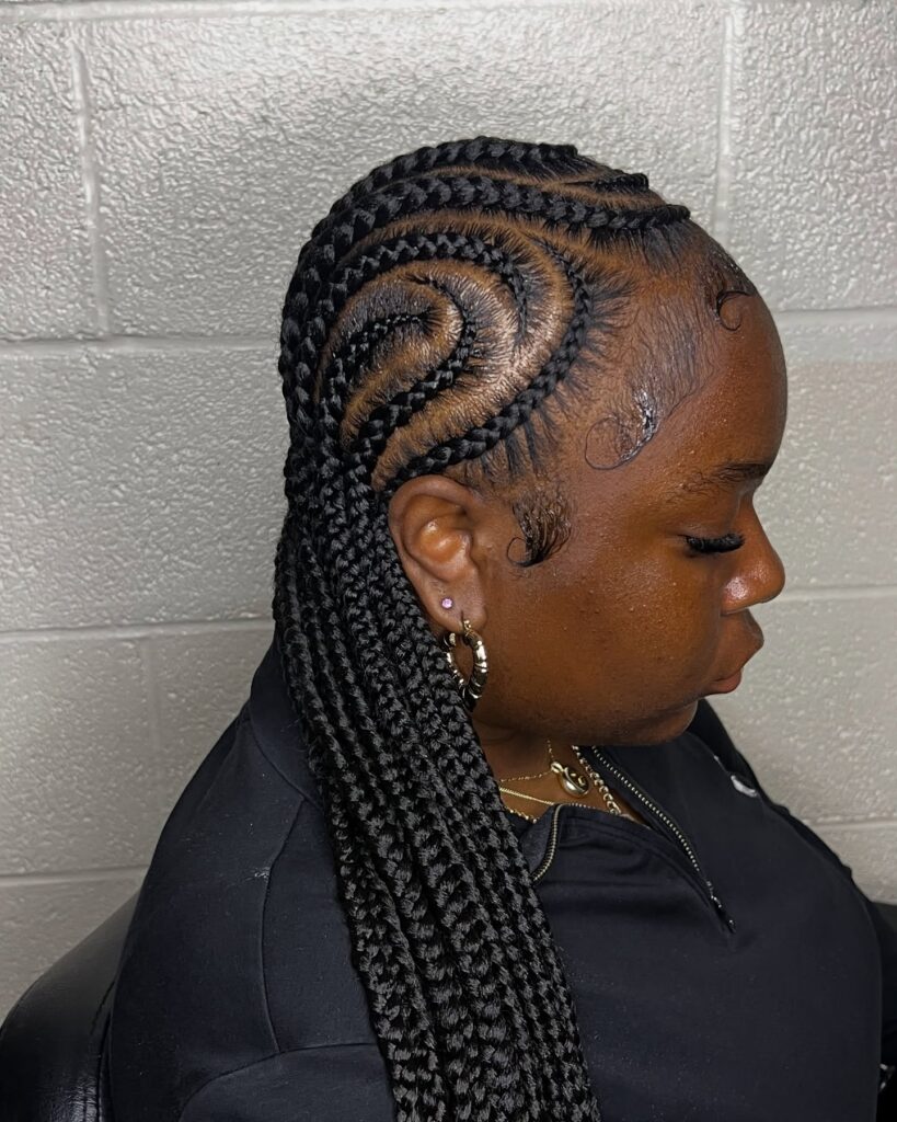 Medium length feed in braids with curved swirl braid patterns.