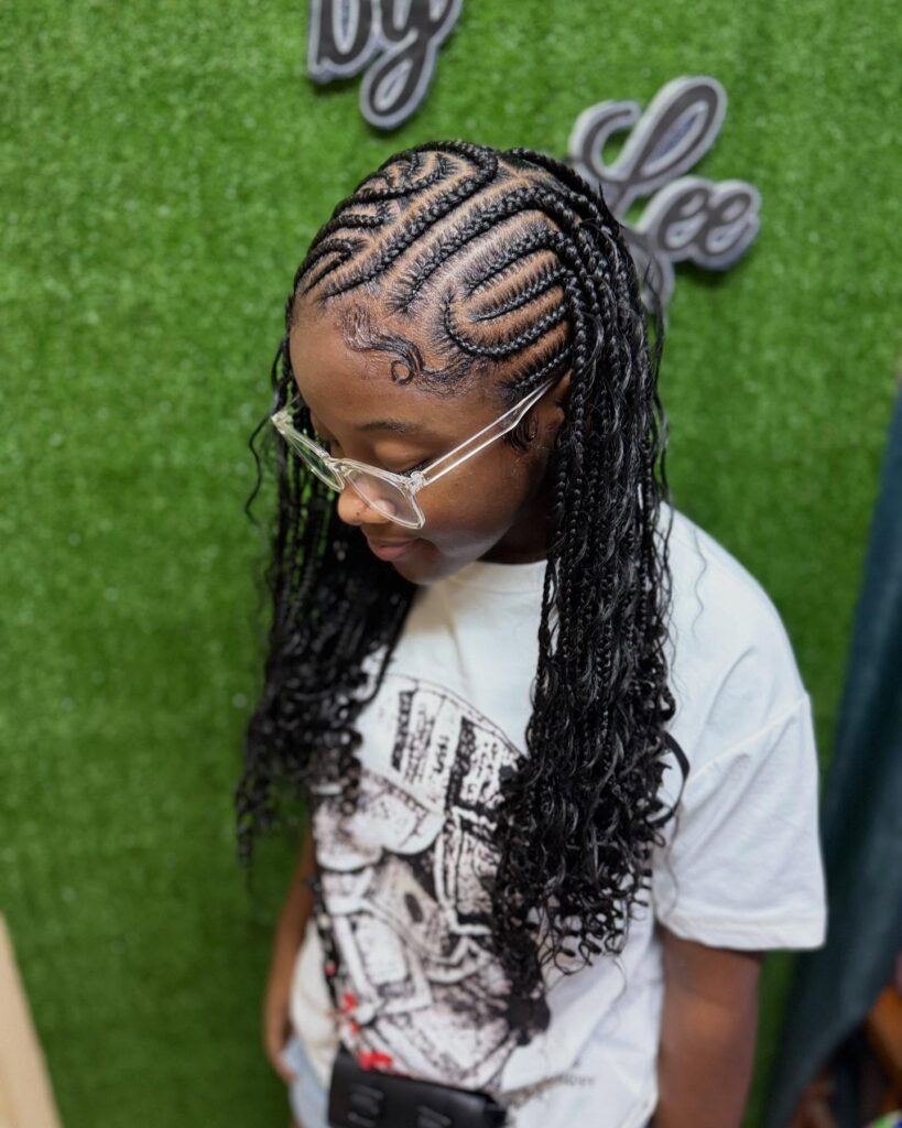 Braided hairstyle with swirl cornrows and loose curly ends.