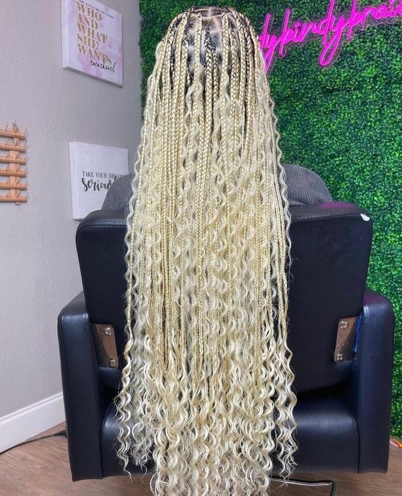 Platinum blonde boho braids with small plaits and full curly texture throughout.