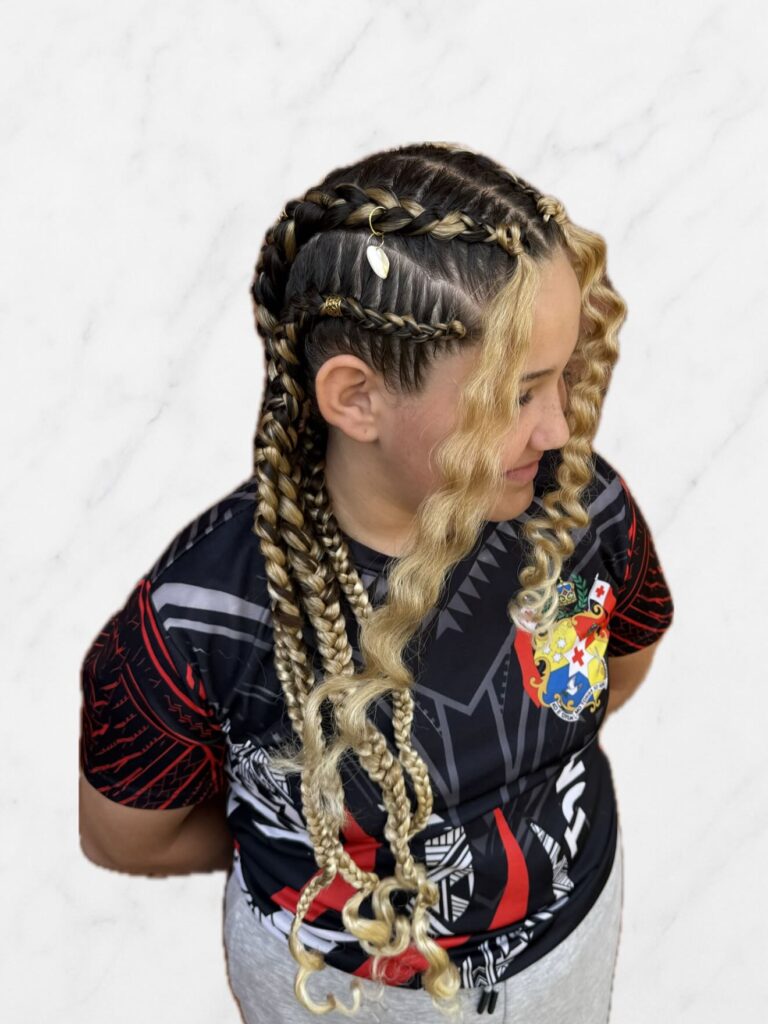 Blonde braided crown style with structured braids and loose curls flowing down.