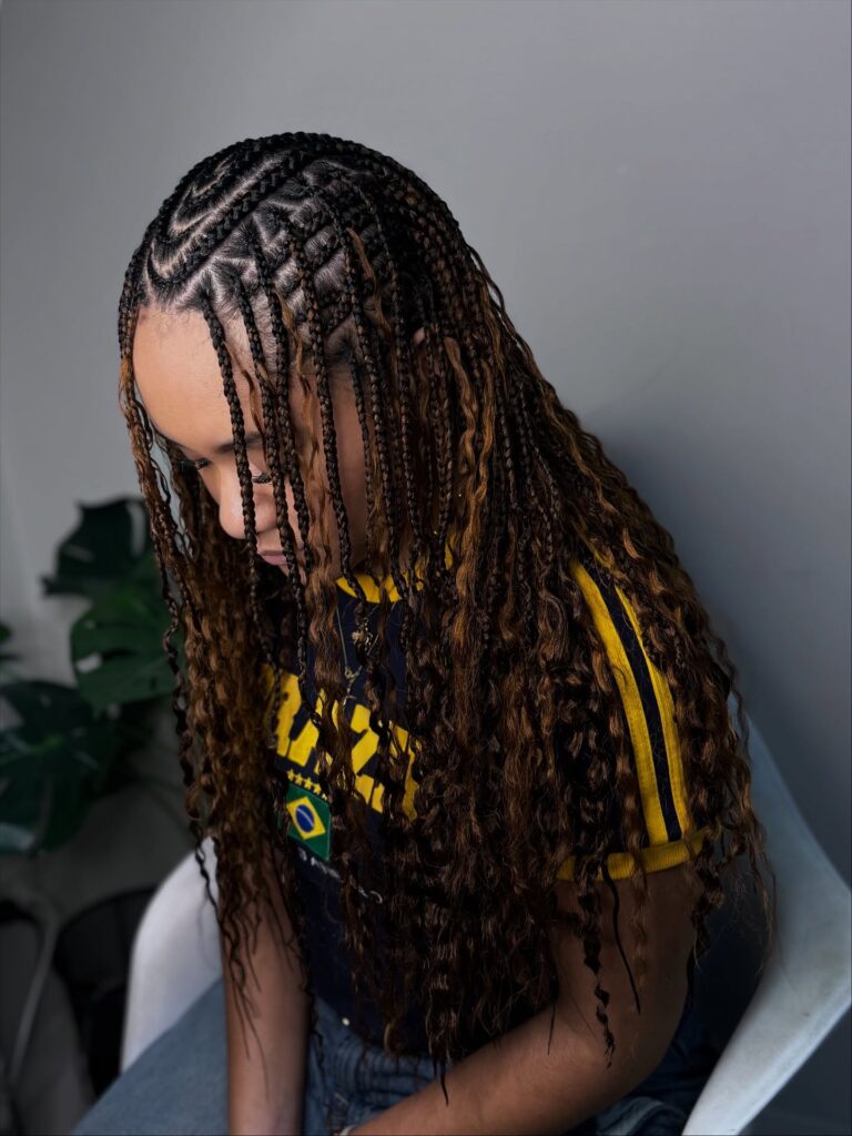 Fulani braids with curly and crimped ends in a rich brown shade.