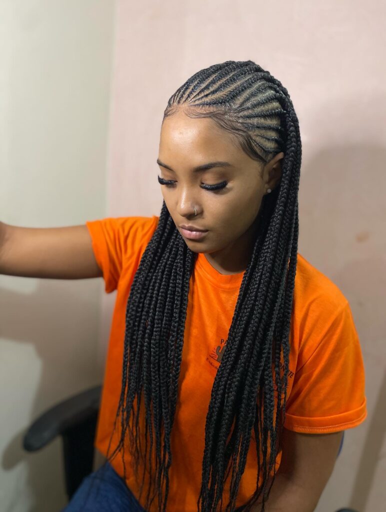 Fulani braids with side cornrow pattern and long straight lengths.