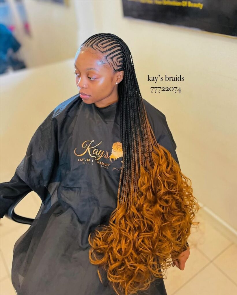 Fulani braids with long lengths and copper brown curly ends in an ombre effect.